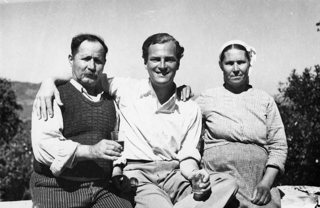Patrick Leigh Fermor with Spiro and Maria Lazaros, owners of the watermill at Lemonodassos, Greece, where he first stayed in the summer of 1935 (Patrick Leigh Fermor Archive/Trustees of the National Library of Scotland)